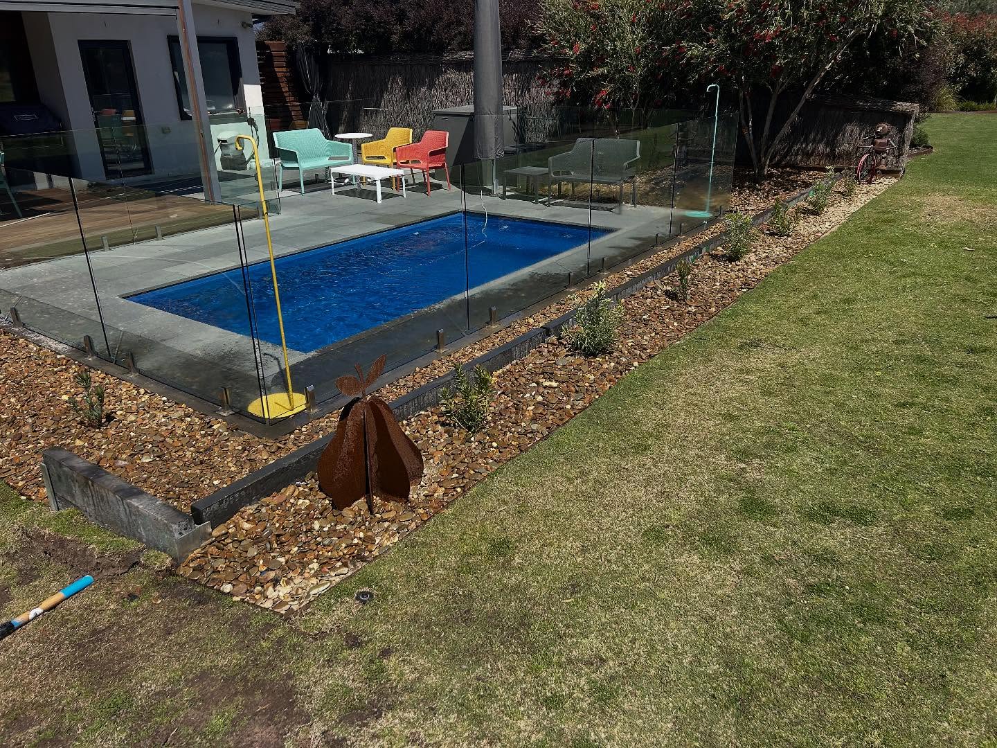 Concrete work on a sloped residential site showing erosion and drainage management