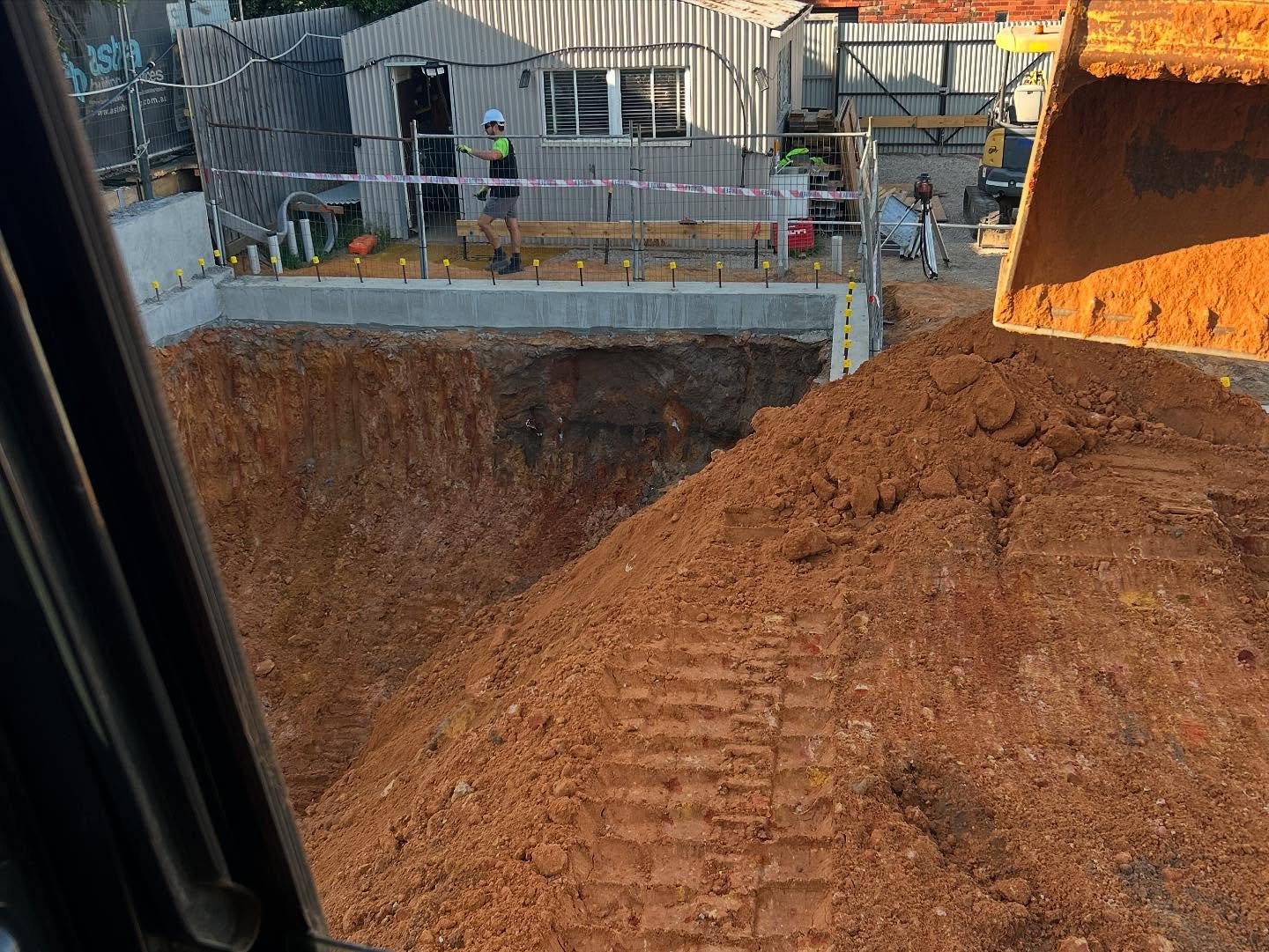 Excavator performing a site cut on a construction project in Geelong